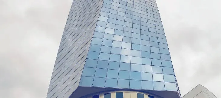 Modern glass façade of Avaz Twist Tower dominating Sarajevo’s skyline


