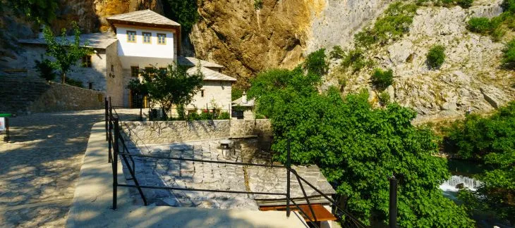 Historic Blagaj Tekija monastery built beside a cliff and river spring