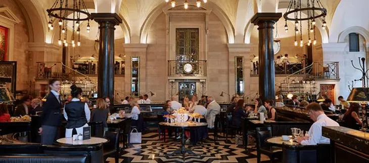 Elegant art deco dining room at The Wolseley with guests enjoying classic British breakfast