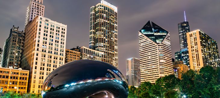 Chicago skyline with reflective Cloud Gate sculpture in Millennium Park