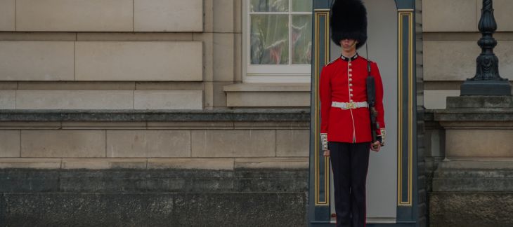 Royal Guards in red uniforms during Changing of the Guard ceremony