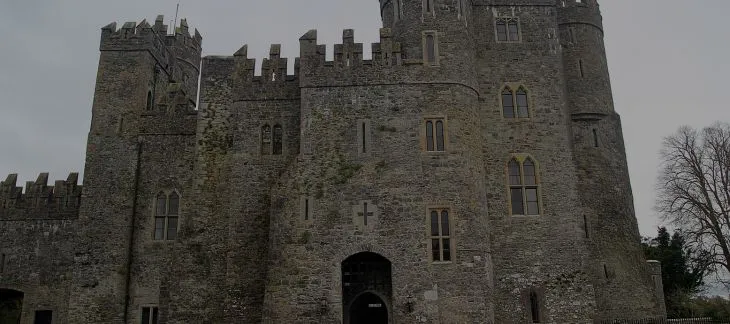 Medieval Hever Castle with surrounding moat and manicured gardens