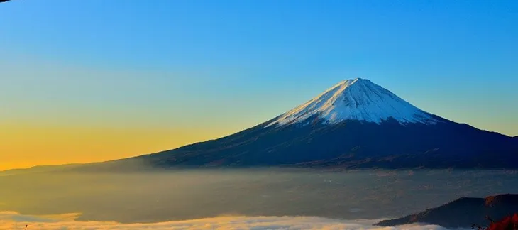 Snow-capped Mount Fuji reflected in Lake Kawaguchi