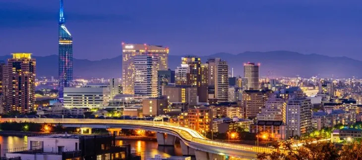 Fukuoka’s riverside skyline with modern architecture and food stalls