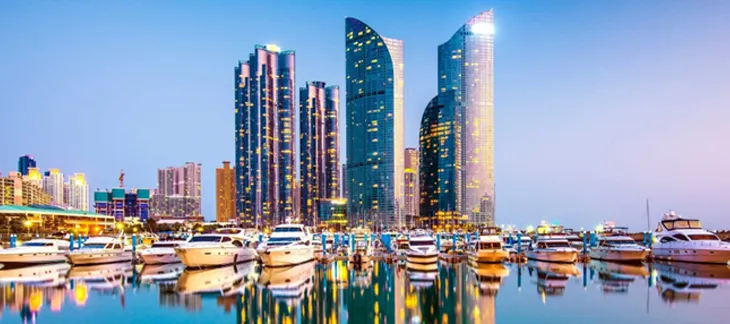Panoramic view of Busan’s coastal skyline with Haeundae Beach and skyscrapers