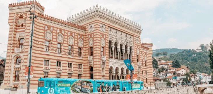 Ornate architecture of Sarajevo City Hall lit up at night