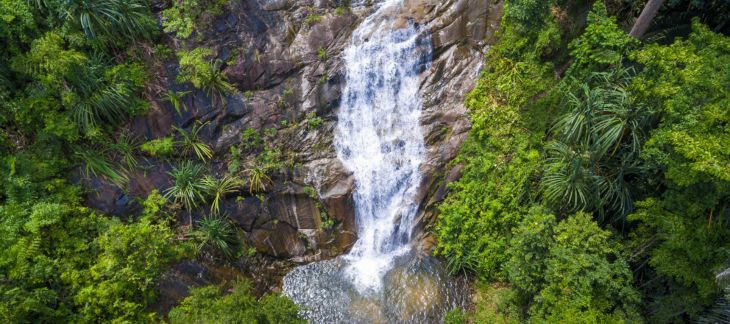 Multiple cascades of the Kravice Waterfalls amidst lush surroundings