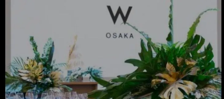 Vibrant and modern hotel façade of W Osaka illuminated at night
