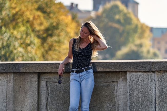 Arooha female guest posing for picture during Prague tour packages from Dubai