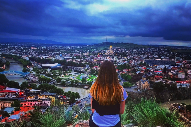 Arooha guest enjoying tibilisi city view during Georgia Tour Packages From Dubai