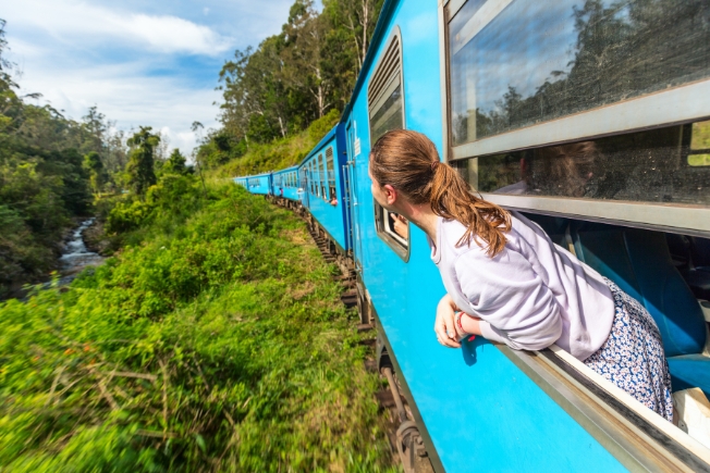 Arooha guest enjoying train ride during Sri Lanka tour packages from Dubai