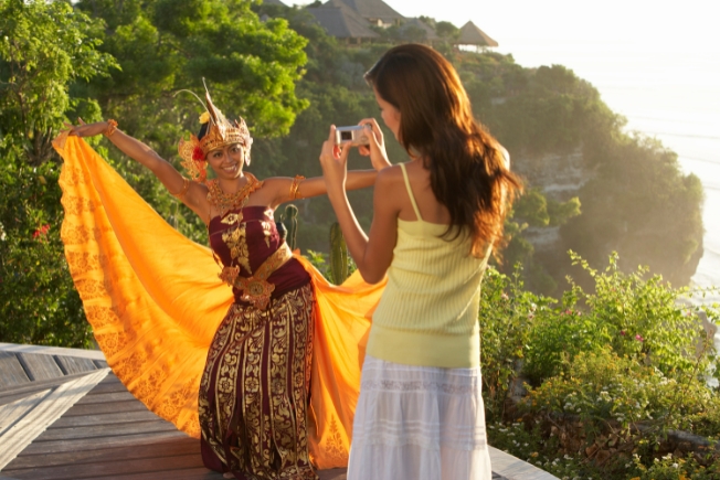 Arooha guest tourist photographing traditional Indonesian dancer