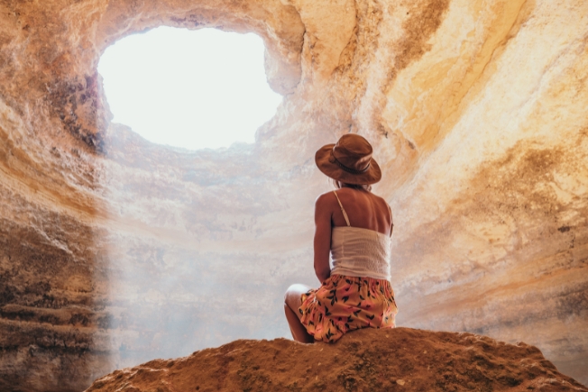 Arooha guest woman contemplating caves in Portugal