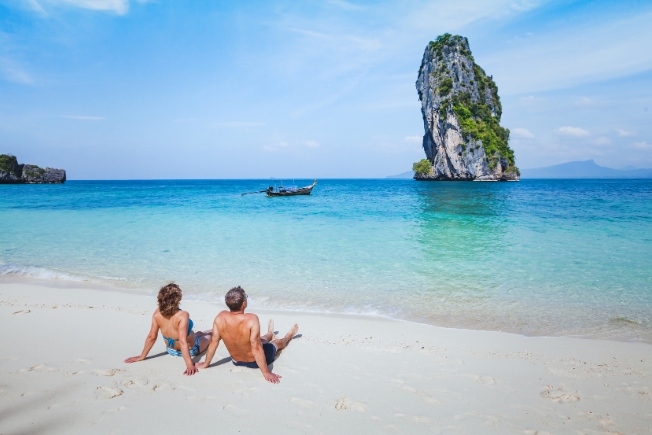 Arooha guest honeymoon couple enjoying beach in Thailand