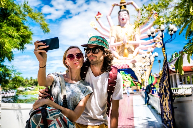 Arooha guest tourist couple taking selfie in Thailand
