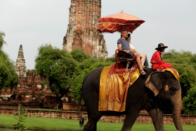 Arooha guest tourists riding elephant in Thailand