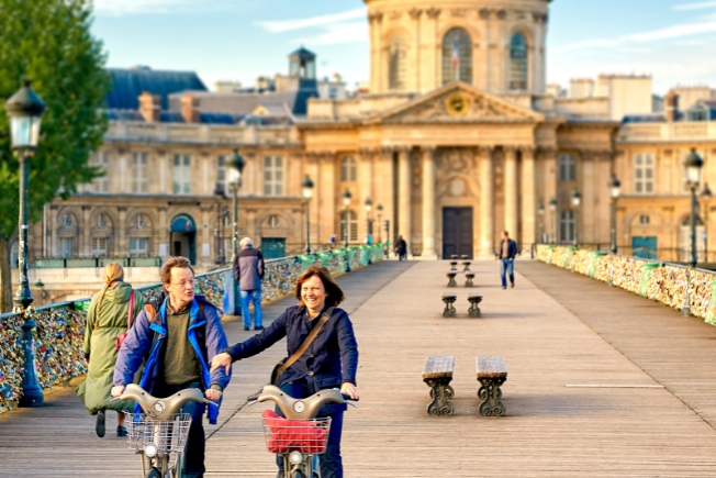 Arooha guest tourist cycling at Paris during France tour packages from Dubai