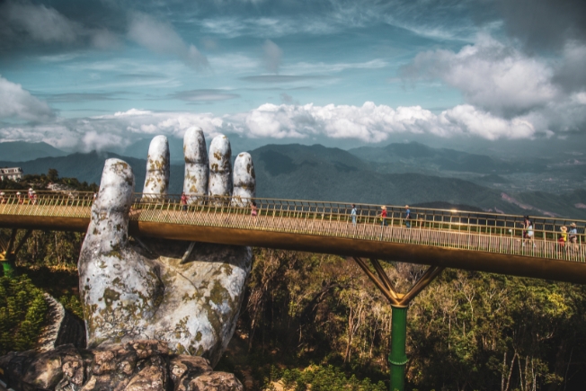 Arooha guest tourist on Golden Bridge in Bana Hill, Da Nang, Vietnam