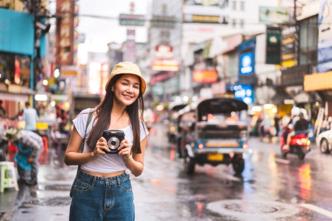 Arooha woman guest with camera at Chinatown