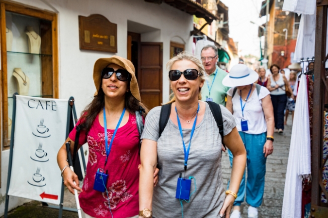 Aroohas guests tourists on street in Kerala