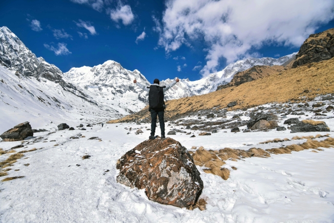 Arooha hiker tourist in snowy Nepal mountains